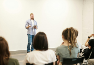 Man speaking on Alcoholic Beverage Control to a group of trainees